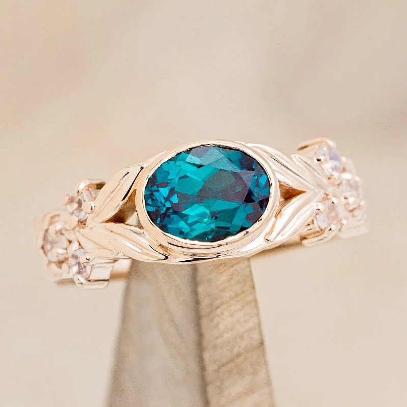 "ELORA" - OVAL CUT LAB-GROWN ALEXANDRITE ENGAGEMENT RING WITH MOONSTONE ACCENTS